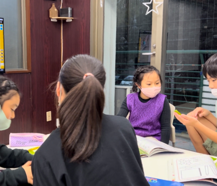 English Students at Zuzu's English Club in Arakawa Tokyo Practice Handwriting